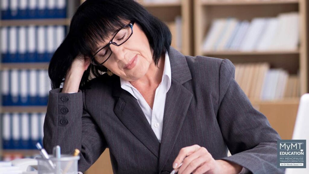 Woman asleep at desk MyMT Education logo